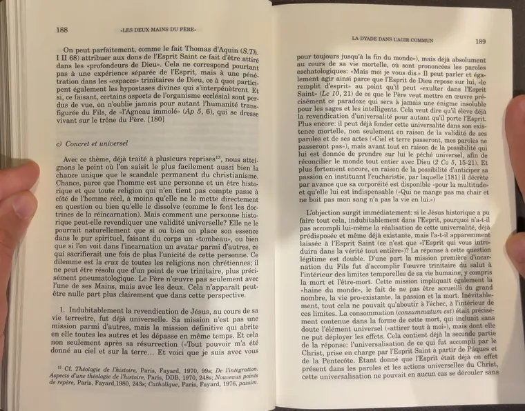 A book spread under uneven light — one page in shadow, the other bright.